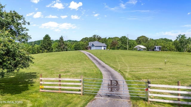 448 Trinity Rd, Morristown, TN 37814 - view of yard with a gate, a rural view, driveway, and a view of trees