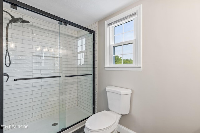 448 Trinity Rd, Morristown, TN 37814 - bathroom featuring a shower stall, baseboards, and toilet