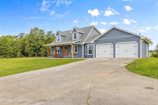 448 Trinity Rd, Morristown, TN 37814 - cape cod house featuring covered porch, a garage, a front lawn, and asphalt driveway