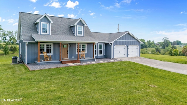 448 Trinity Rd, Morristown, TN 37814 - cape cod house with covered porch, an attached garage, central air condition unit, and a front lawn