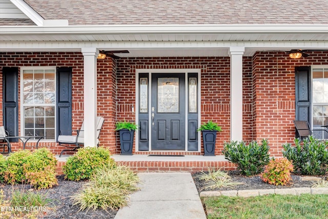 2034 Cherokee Dr, Maryville, TN 37801 - view of exterior entry with brick siding, a shingled roof, and covered porch