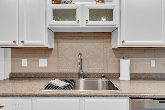 2034 Cherokee Dr, Maryville, TN 37801 - kitchen featuring a sink, stainless steel dishwasher, white cabinetry, and glass insert cabinets