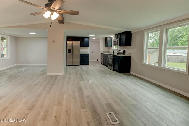 168 Misty Mountain Dr, Maryville, TN 37803 - unfurnished living room featuring baseboards, plenty of natural light, light wood-style flooring, and a ceiling fan