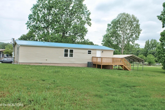 168 Misty Mountain Dr, Maryville, TN 37803 - rear view of house featuring a yard, a wooden deck, metal roof, a carport, and central AC unit