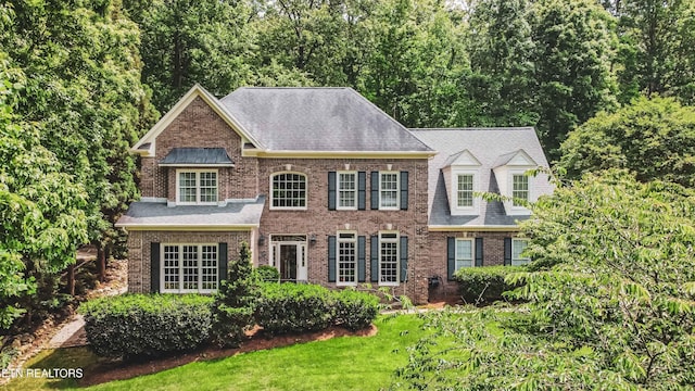 129 Whippoorwill Dr, Oak Ridge, TN 37830 - colonial inspired home featuring brick siding, roof with shingles, and a front lawn