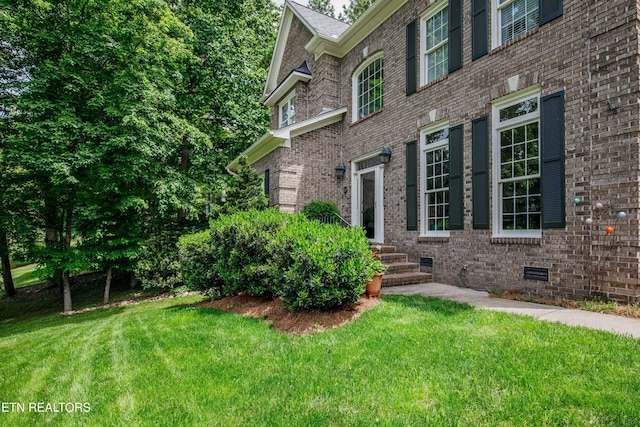 129 Whippoorwill Dr, Oak Ridge, TN 37830 - view of side of home with brick siding and a lawn
