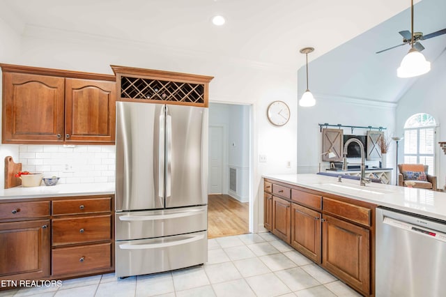 129 Whippoorwill Dr, Oak Ridge, TN 37830 - kitchen with stainless steel appliances, a sink, light countertops, crown molding, and backsplash