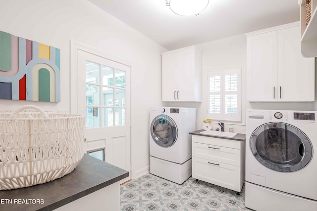 129 Whippoorwill Dr, Oak Ridge, TN 37830 - laundry room featuring cabinet space and washing machine and clothes dryer