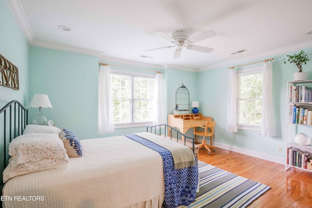 129 Whippoorwill Dr, Oak Ridge, TN 37830 - bedroom with multiple windows, hardwood / wood-style flooring, ornamental molding, baseboards, and ceiling fan