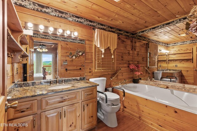 1949 E Mountain View Way, Sevierville, TN 37876 - bathroom with wood ceiling, toilet, a bath, wood finished floors, and wood walls