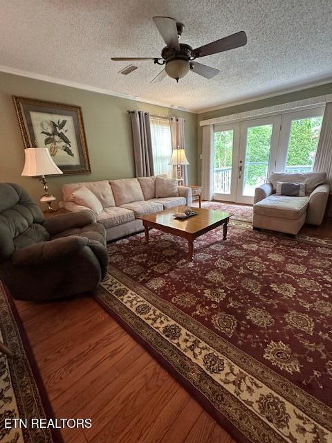 5230 Brig Ln, Knoxville, TN 37914 - living area featuring wood finished floors, ceiling fan, a textured ceiling, french doors, and ornamental molding