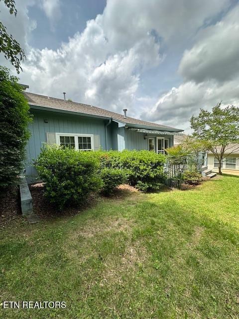 5230 Brig Ln, Knoxville, TN 37914 - rear view of property featuring a lawn and board and batten siding