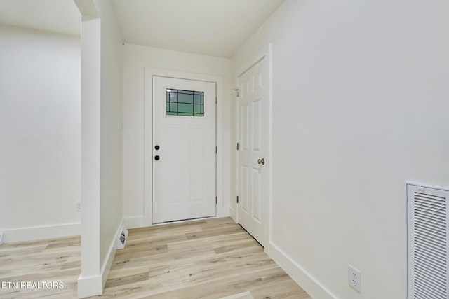 1122 N Shady Lane Loop, Clarkrange, TN 38553 - doorway to outside with light wood-type flooring, baseboards, and a heating unit
