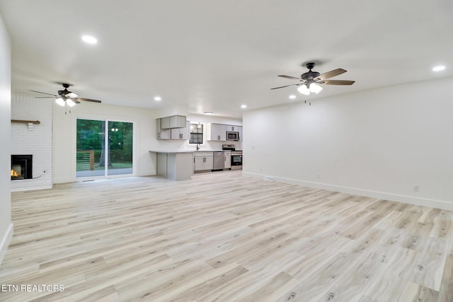 1122 N Shady Lane Loop, Clarkrange, TN 38553 - unfurnished living room featuring ceiling fan, light wood-type flooring, recessed lighting, and baseboards