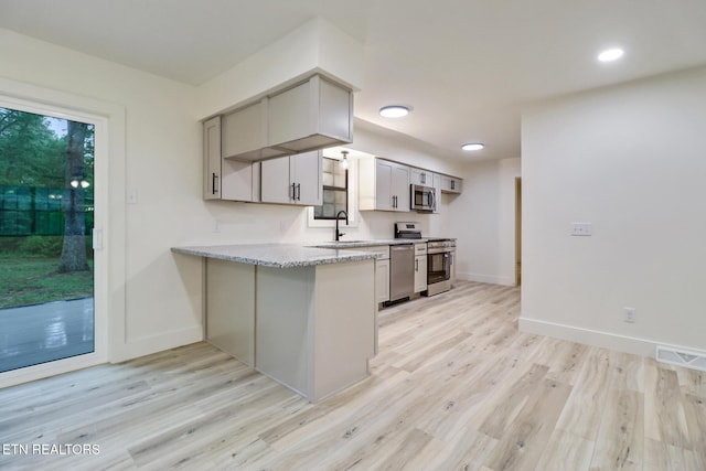 1122 N Shady Lane Loop, Clarkrange, TN 38553 - kitchen with stainless steel appliances, a sink, light wood finished floors, baseboards, and recessed lighting