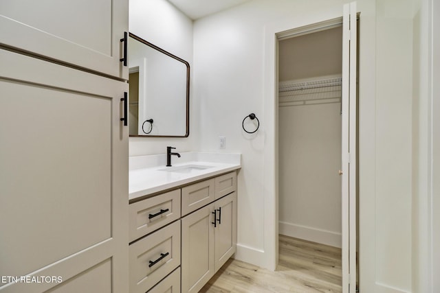 1122 N Shady Lane Loop, Clarkrange, TN 38553 - bathroom with wood finished floors, vanity, and baseboards