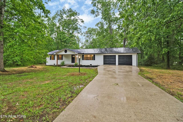 1122 N Shady Lane Loop, Clarkrange, TN 38553 - ranch-style home with metal roof, an attached garage, driveway, and a front yard