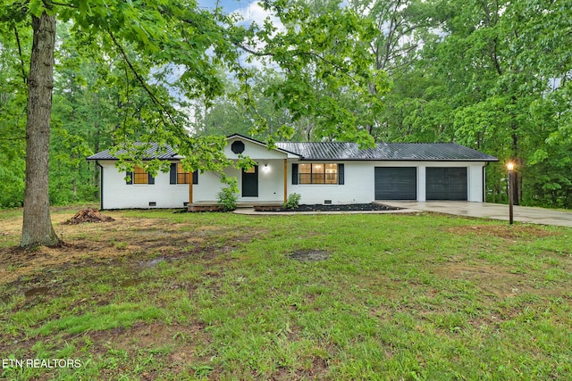 1122 N Shady Lane Loop, Clarkrange, TN 38553 - ranch-style home with concrete driveway, metal roof, an attached garage, and a front lawn