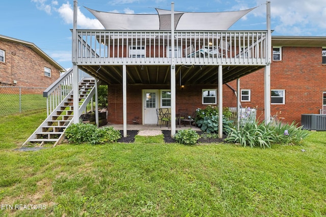 7613 Scenic View Dr, Knoxville, TN 37938 - back of property with a deck, stairway, central AC, a patio, and brick siding