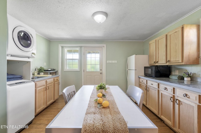 7613 Scenic View Dr, Knoxville, TN 37938 - kitchen with black microwave, light wood finished floors, ornamental molding, light countertops, and a textured ceiling