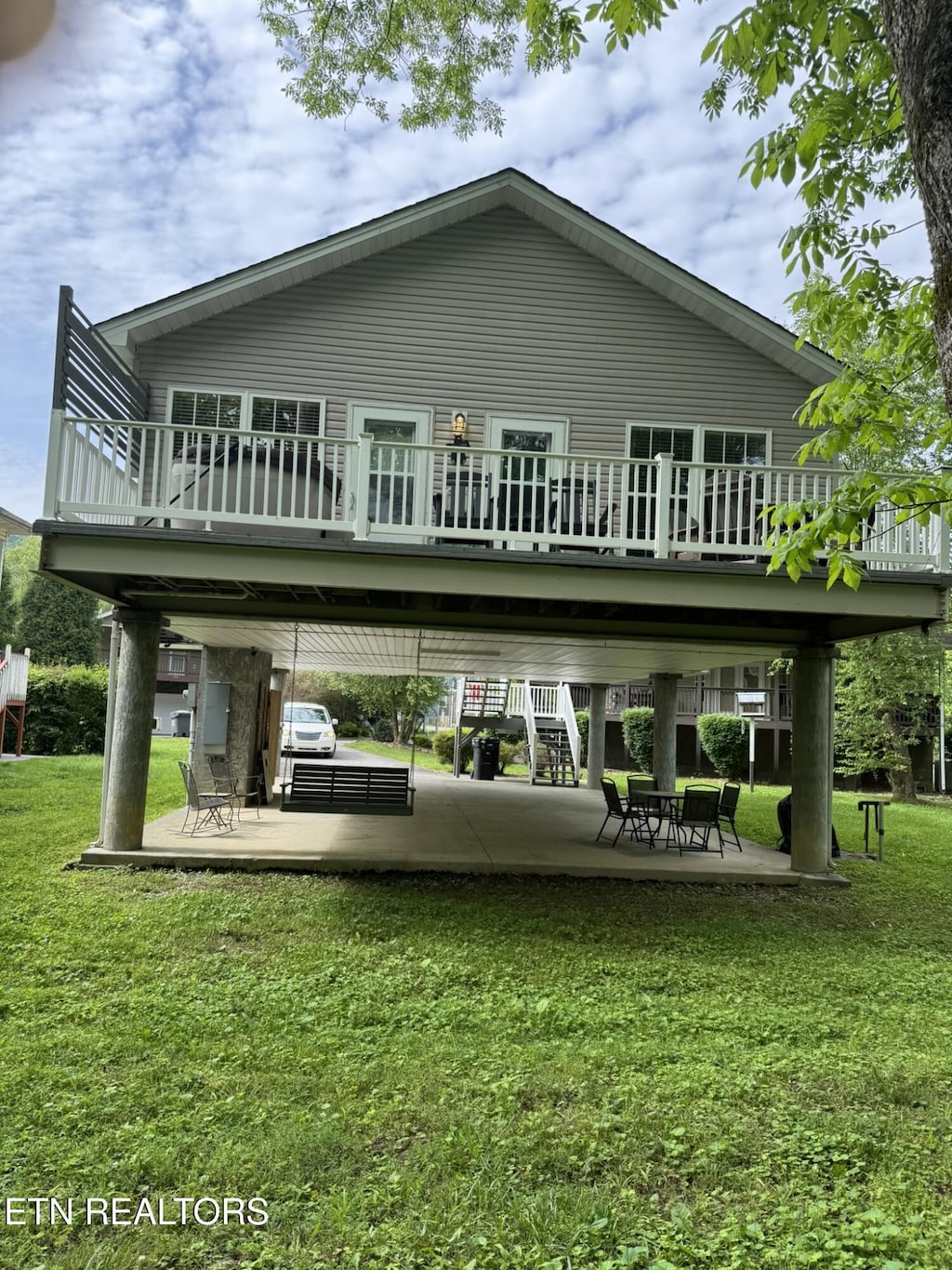 2032 Slippery Rock Cir, Pigeon Forge, TN 37862 - back of house featuring a yard, stairs, a deck, and a patio area