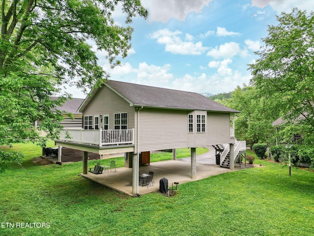 2032 Slippery Rock Cir, Pigeon Forge, TN 37862 - back of property with a patio, a yard, stairs, a carport, and a wooden deck