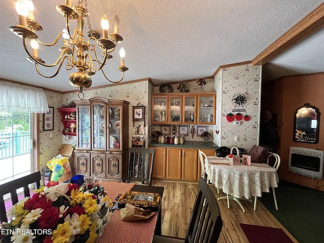 130 New Light Cir, Winfield, TN 37892 - dining area with heating unit, wallpapered walls, ornamental molding, a chandelier, and a textured ceiling