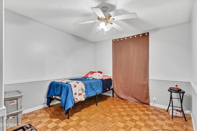 501 Park Ave, Clinton, TN 37716 - bedroom with a textured ceiling, wainscoting, baseboards, and ceiling fan