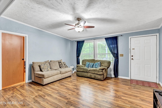 501 Park Ave, Clinton, TN 37716 - living area with wood finished floors, ceiling fan, a textured ceiling, ornamental molding, and baseboards