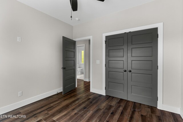 270 W Main St, Dandridge, TN 37725 - unfurnished bedroom with dark wood-style flooring, baseboards, a closet, and ceiling fan