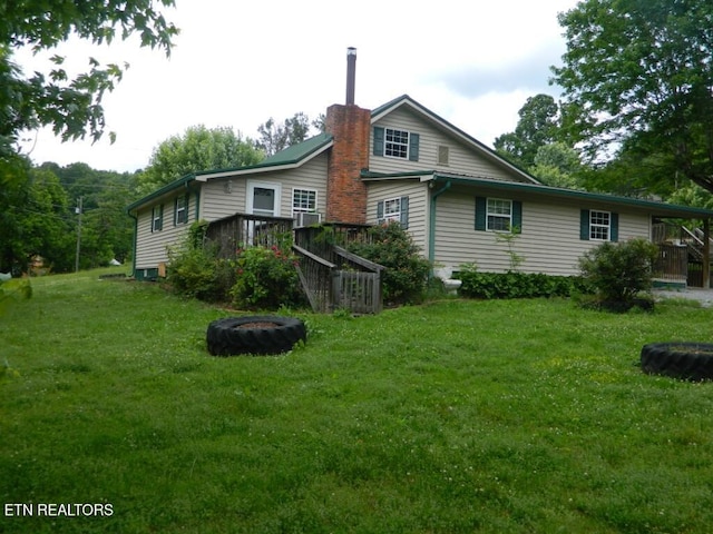 232 Sallings Rd, Luttrell, TN 37779 - rear view of property with a fire pit, a chimney, a yard, and a deck
