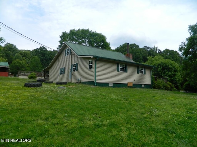 232 Sallings Rd, Luttrell, TN 37779 - view of property exterior with a lawn, a chimney, and metal roof