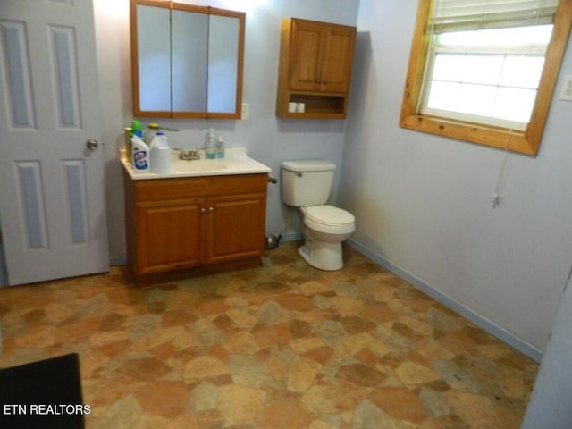 232 Sallings Rd, Luttrell, TN 37779 - bathroom featuring baseboards, toilet, and vanity