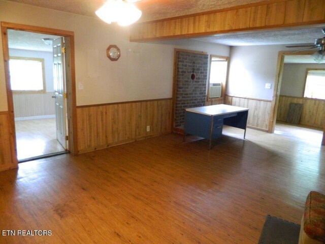 232 Sallings Rd, Luttrell, TN 37779 - unfurnished room with a wainscoted wall, healthy amount of natural light, wood finished floors, wooden walls, and ceiling fan