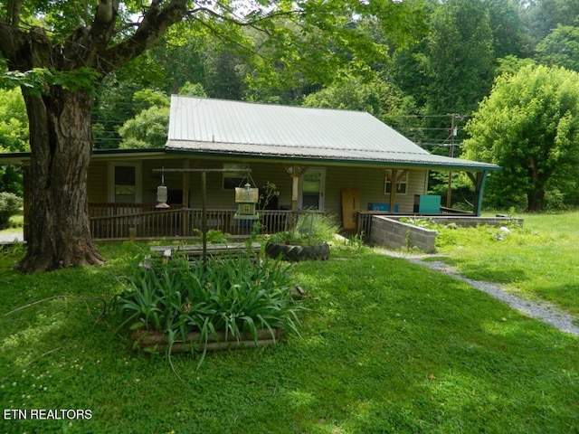 232 Sallings Rd, Luttrell, TN 37779 - farmhouse with a porch, metal roof, and a front yard