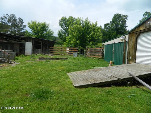 232 Sallings Rd, Luttrell, TN 37779 - view of yard featuring a deck and an outbuilding