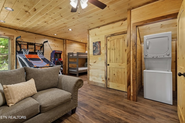 1705 Pkwy View Ct, Sevierville, TN 37876 - bedroom featuring stacked washing machine and dryer, wood ceiling, wood finished floors, recessed lighting, and wood walls