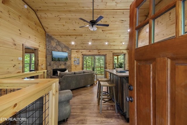 1705 Pkwy View Ct, Sevierville, TN 37876 - living room featuring plenty of natural light, wood ceiling, high vaulted ceiling, a stone fireplace, and wood finished floors