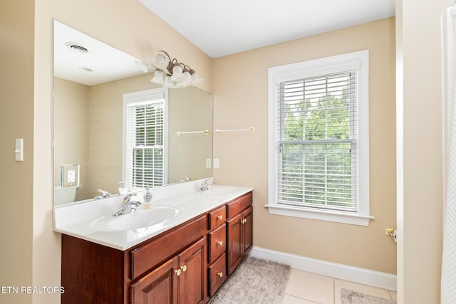 817 Vista Oaks Ln, Knoxville, TN 37919 - bathroom featuring double vanity, baseboards, and tile patterned floors