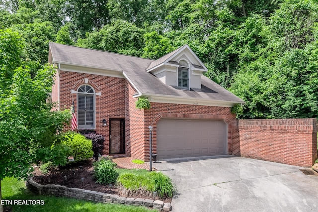 1403 Kenton Way, Knoxville, TN 37922 - view of front of home featuring a garage, driveway, and brick siding