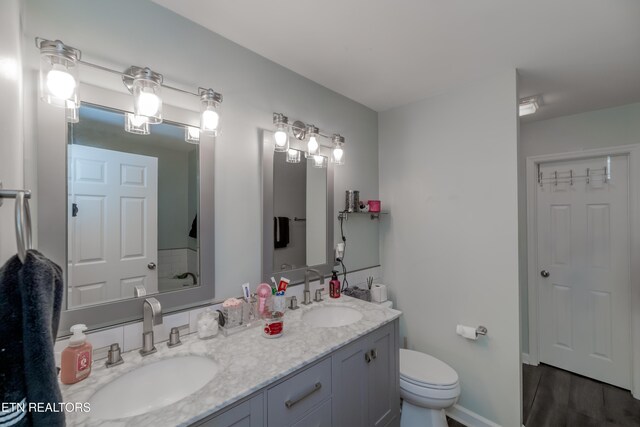 1403 Kenton Way, Knoxville, TN 37922 - full bathroom with toilet, double vanity, wood finished floors, and baseboards