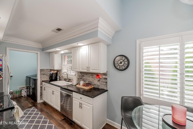 1403 Kenton Way, Knoxville, TN 37922 - kitchen featuring stainless steel appliances, a sink, tasteful backsplash, dark countertops, and white cabinetry