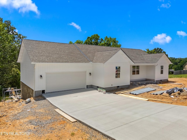 136 Dudley Ln, Tazewell, TN 37879 - view of front facade featuring a shingled roof, an attached garage, concrete driveway, and crawl space
