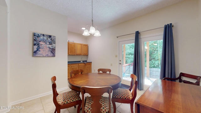 1859 Poplar Hill Rd, Knoxville, TN 37922 - dining room with a chandelier, a textured ceiling, baseboards, and light tile patterned flooring
