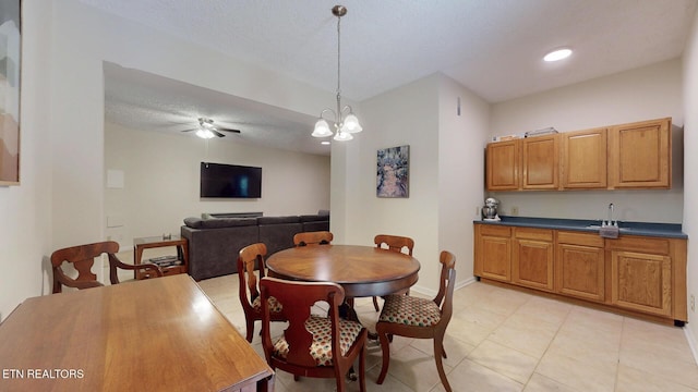 1859 Poplar Hill Rd, Knoxville, TN 37922 - dining space with a ceiling fan, light tile patterned floors, baseboards, a textured ceiling, and a chandelier