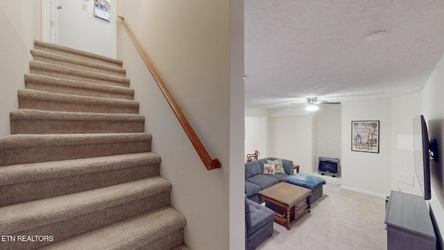 1859 Poplar Hill Rd, Knoxville, TN 37922 - stairway with carpet floors, ceiling fan, a textured ceiling, and baseboards