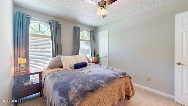 1859 Poplar Hill Rd, Knoxville, TN 37922 - bedroom featuring carpet flooring, multiple windows, baseboards, a textured ceiling, and ceiling fan