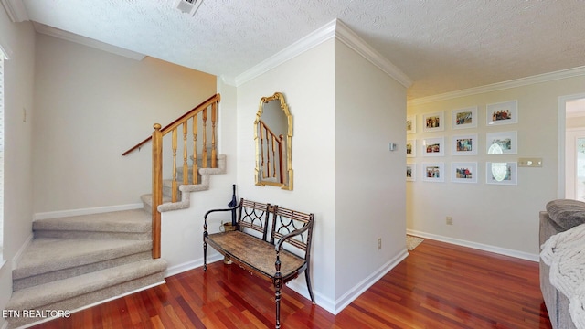 1859 Poplar Hill Rd, Knoxville, TN 37922 - stairway featuring wood finished floors, a textured ceiling, crown molding, and baseboards