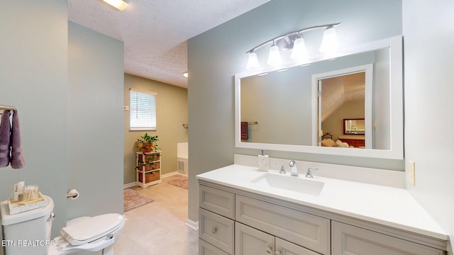1859 Poplar Hill Rd, Knoxville, TN 37922 - bathroom featuring a textured ceiling, vanity, connected bathroom, toilet, and baseboards