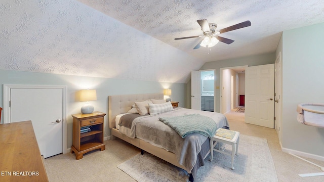 1859 Poplar Hill Rd, Knoxville, TN 37922 - bedroom with a textured ceiling, light colored carpet, vaulted ceiling, baseboards, and connected bathroom